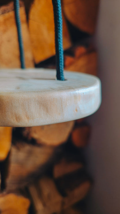 Close-up of a live edge spalted sycamore plant hanger, blurred background