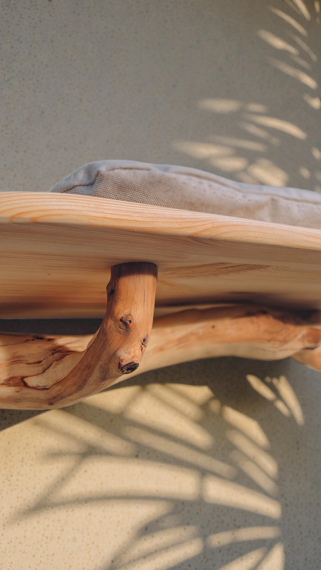 close up of solid wood branch wall shelf
