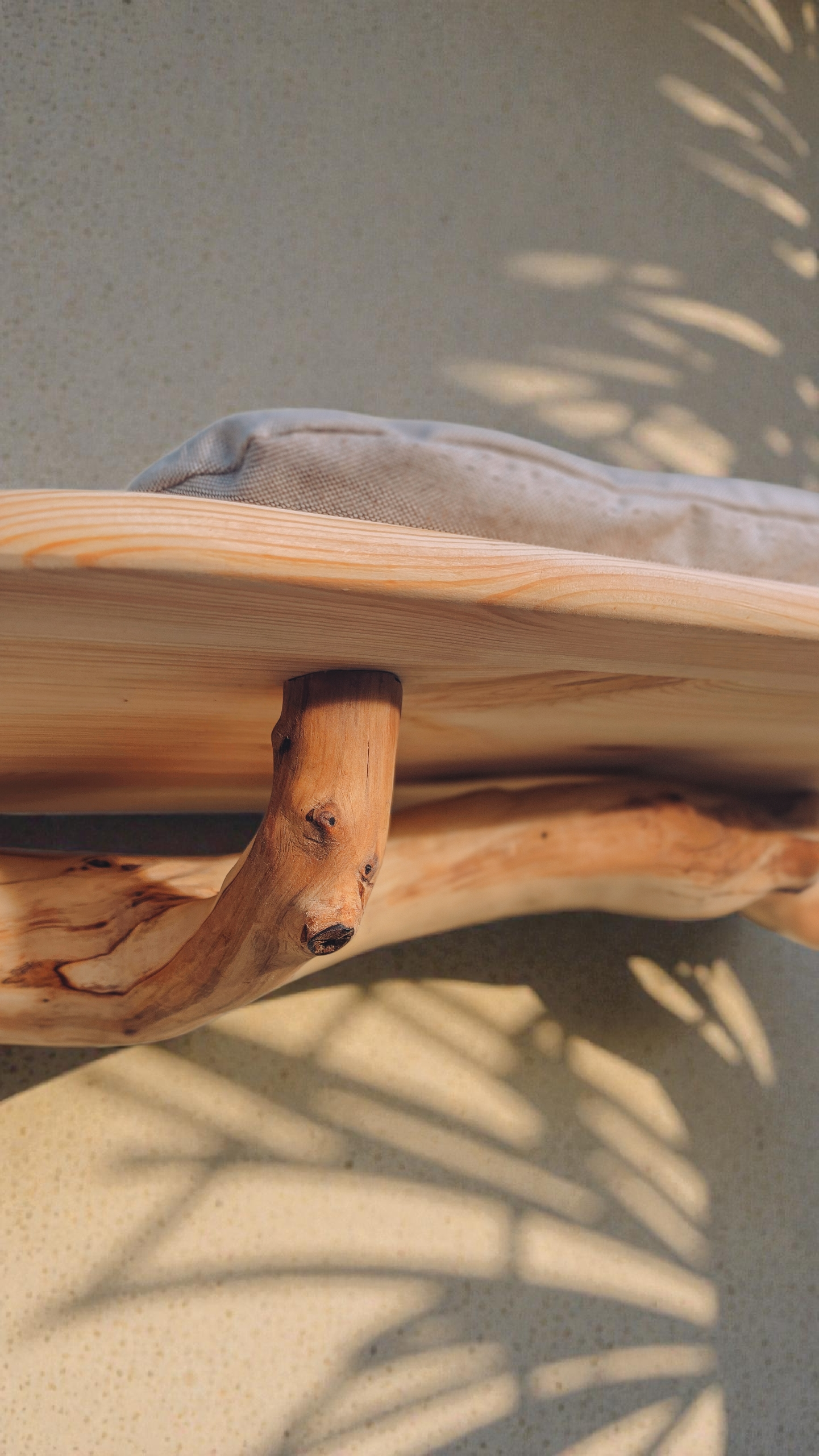 close up of solid wood branch wall shelf
