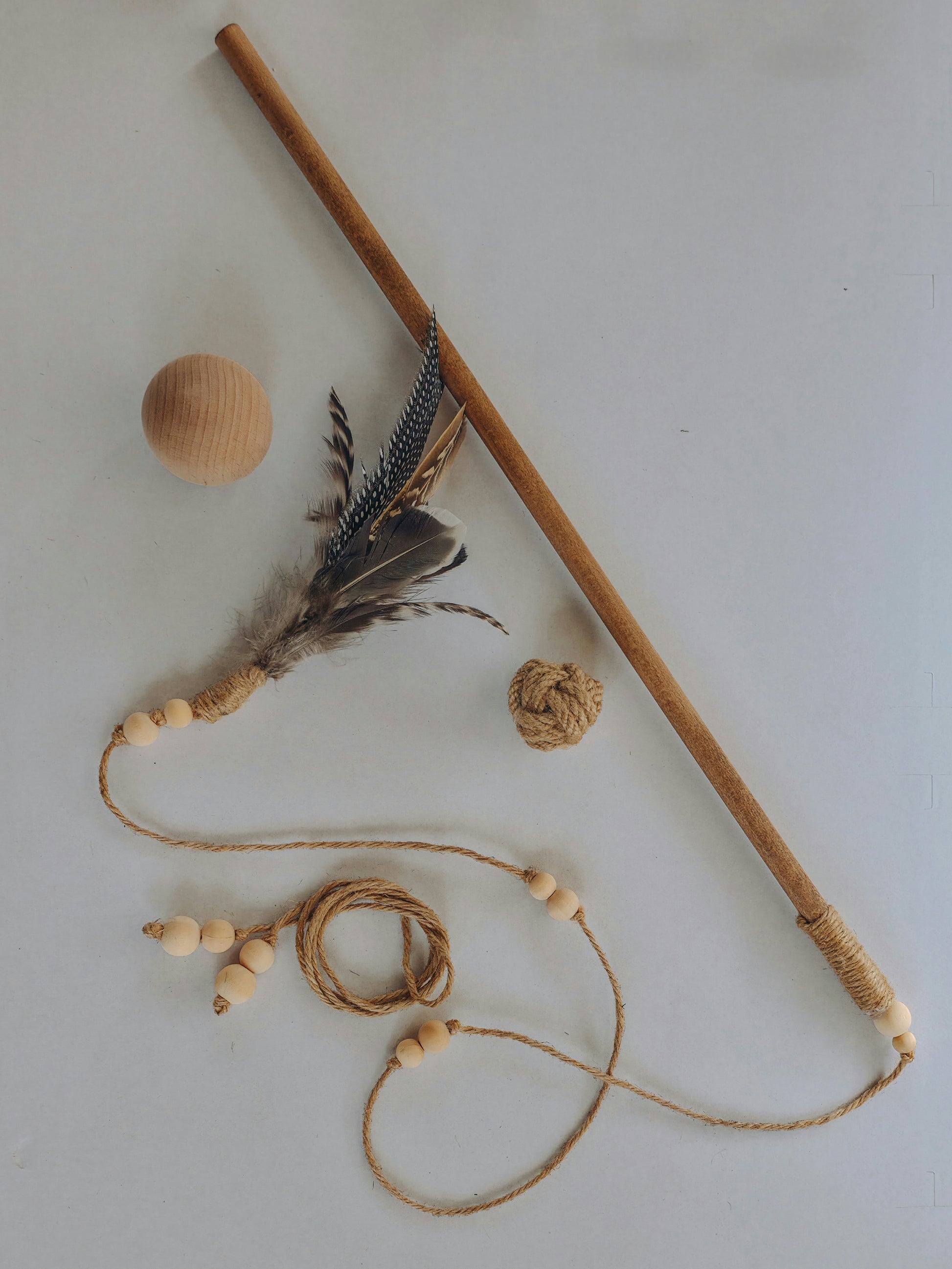 Natural wood and feather cat toy set with jute rope and wood balls