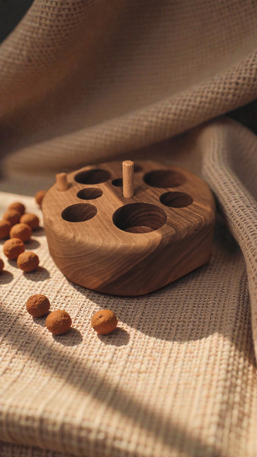 Solid wood cat feeding puzzle and chew toy with linen background interior home 