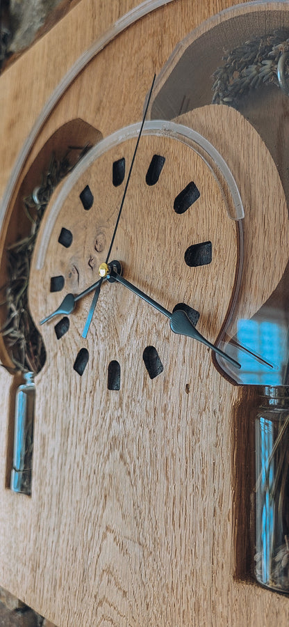 Wooden clock with glass cover on a wooden surface