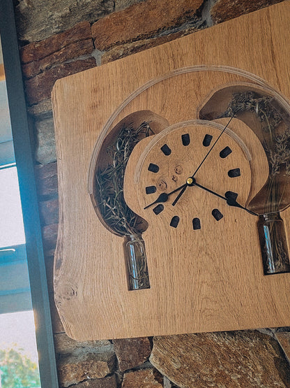 Wooden clock with glass panels on a stone wall