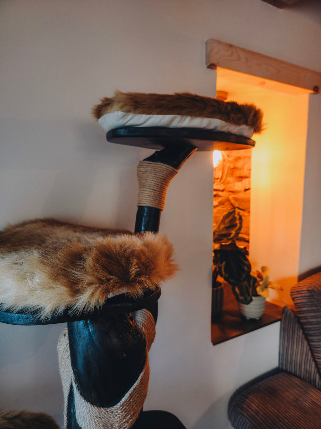 solid wood Cat tree with fluffy cushioned platforms in a cozy room setting